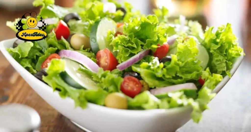 A vibrant salad featuring tomatoes, cucumbers, olives, and lettuce, embodying "Salad Puns: Tossing Words and Dressing Up Idioms.