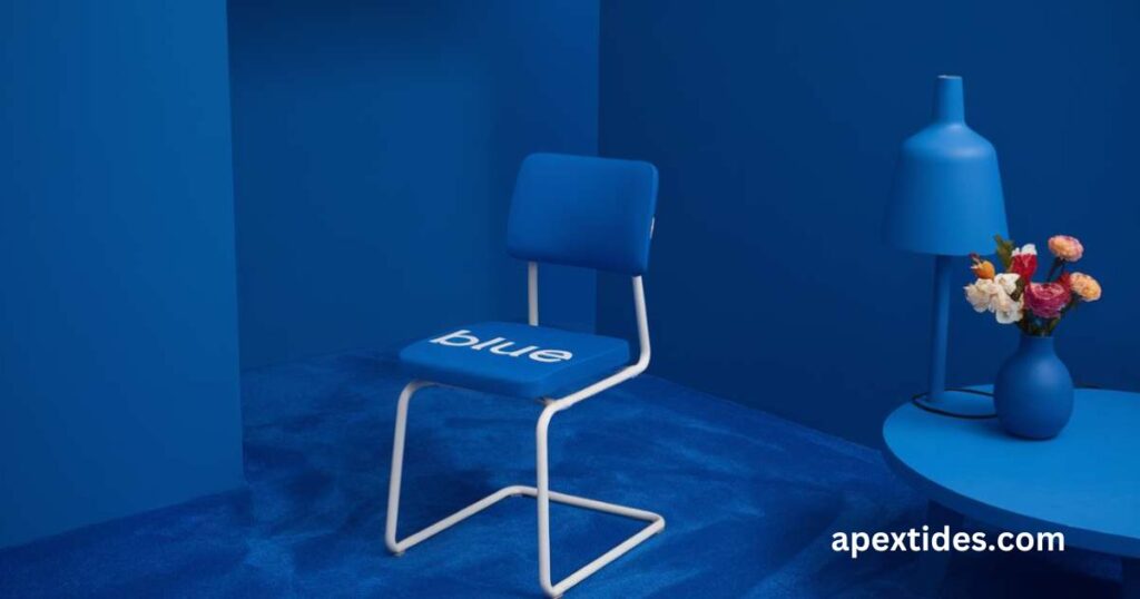 A blue chair against a blue background, accompanied by a vase, exemplifying blue-tifully-crafted-wordplay-for-blue-puns.