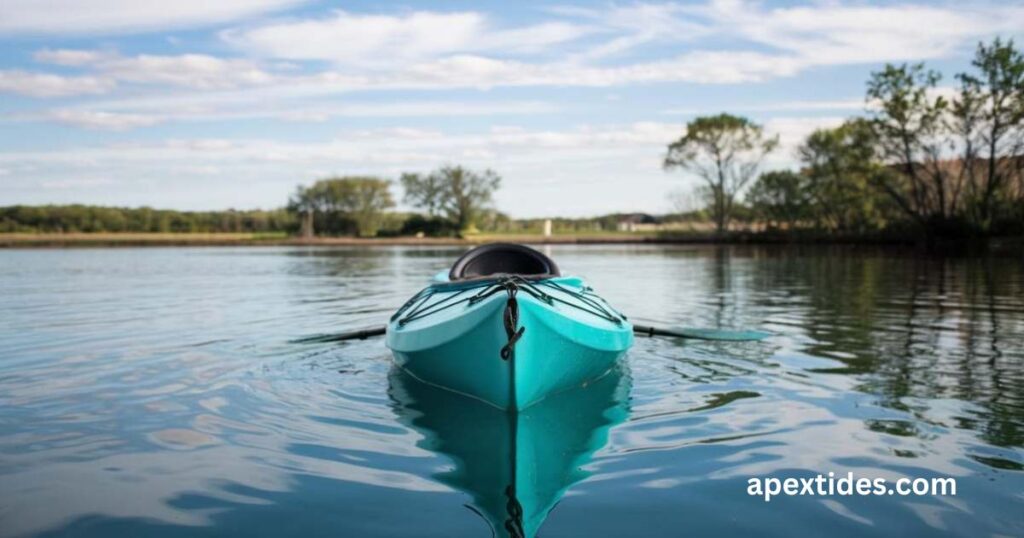 A kayak glides across the water under a clear blue sky, embodying the essence of turquoising-through-a-sea-of-laughter.